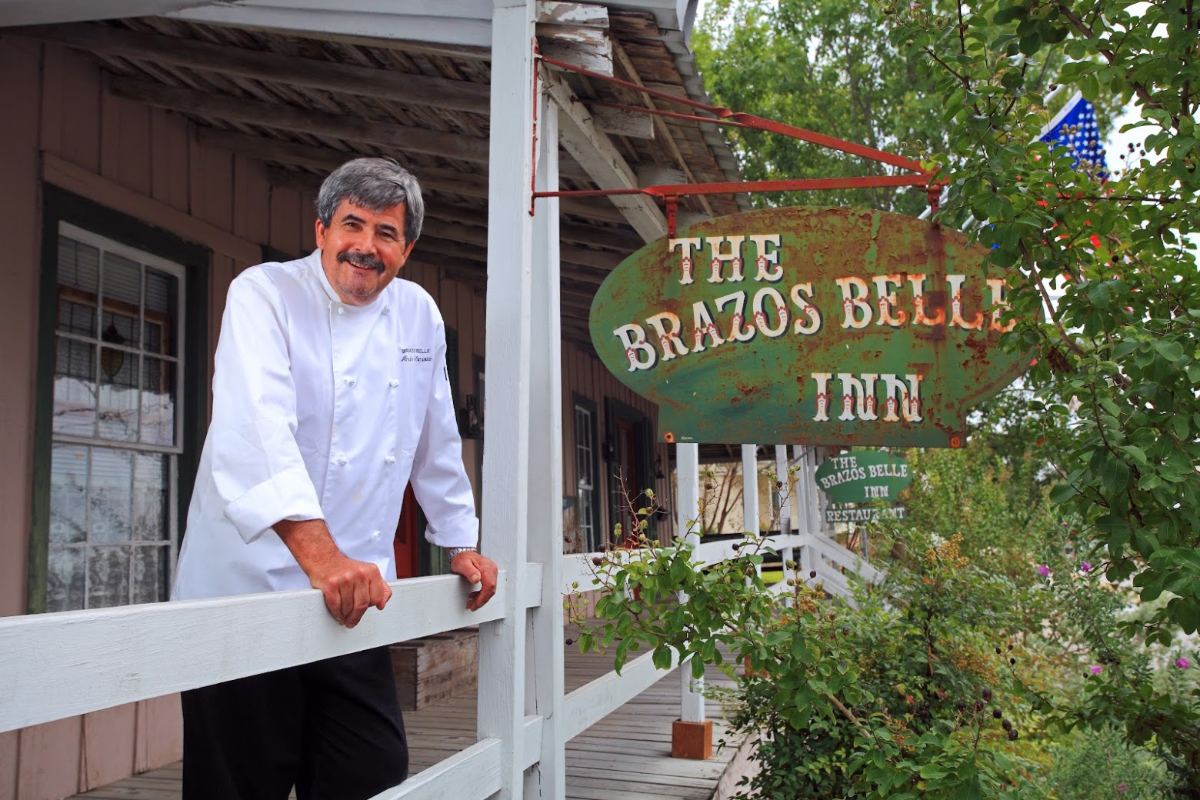 Chef Andre on the porch of the Brazos Belle